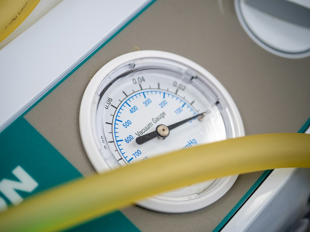 A close up of a thermometer and a hose